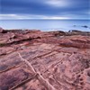 Sandstone rocks and sea view, Isle fo Arran, Scotland, UK